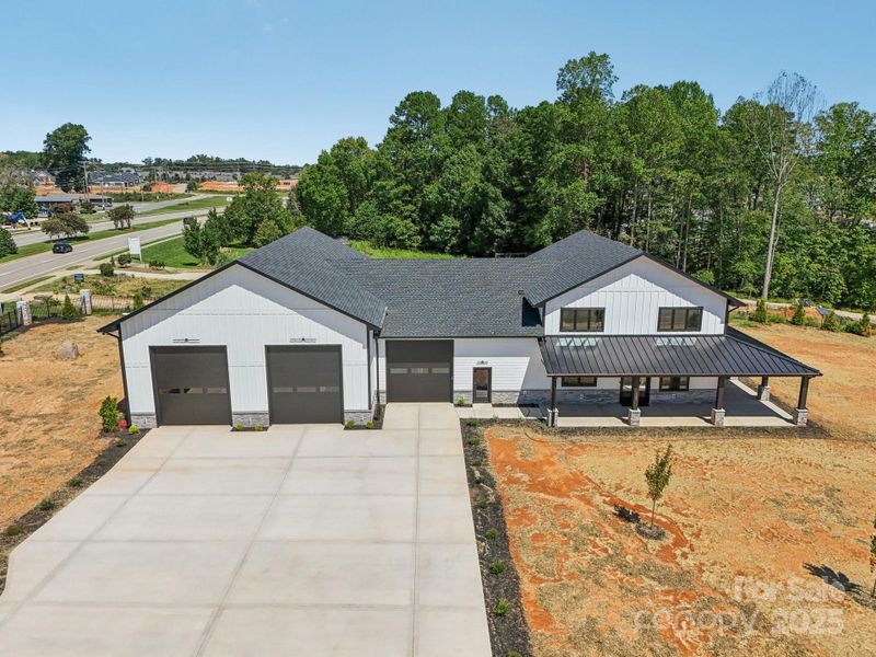 Front exterior of a new home in , Mooresville, NC, highlighting curb appeal (Image 2). Front exterior of a new home in , Mooresville, NC, highlighting curb appeal (Image 2).