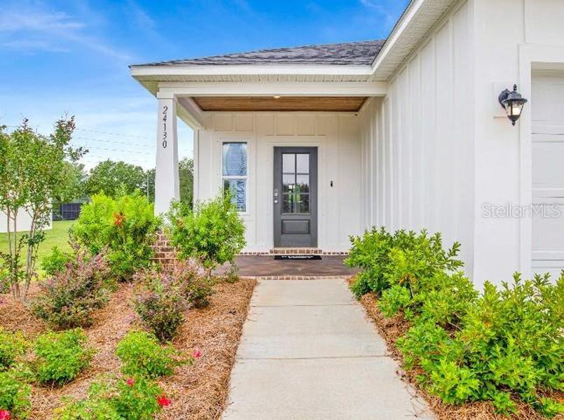 Exterior details and patio area of a home in The Reserve At Hammock Oaks, Lady Lake (Image 2).