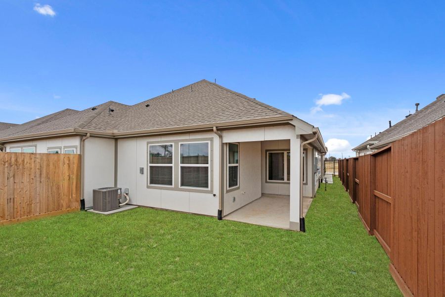 Exterior details and patio area of a home in Meridiana, Manvel (Image 3).