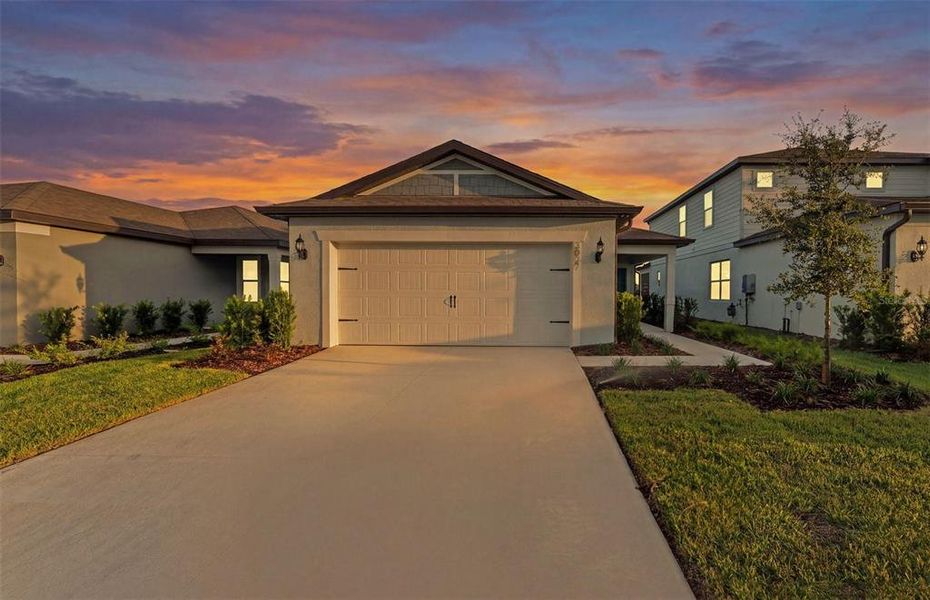 Front exterior of a new home in Twisted Oaks, Wildwood, FL, highlighting curb appeal (Image 1). Front exterior of a new home in Twisted Oaks, Wildwood, FL, highlighting curb appeal (Image 1).