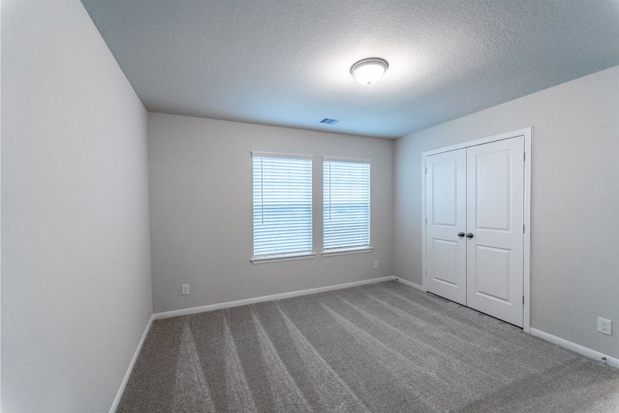 Spacious, unfurnished interior of a new home in Creekhaven, Iowa Colony (Image 22).