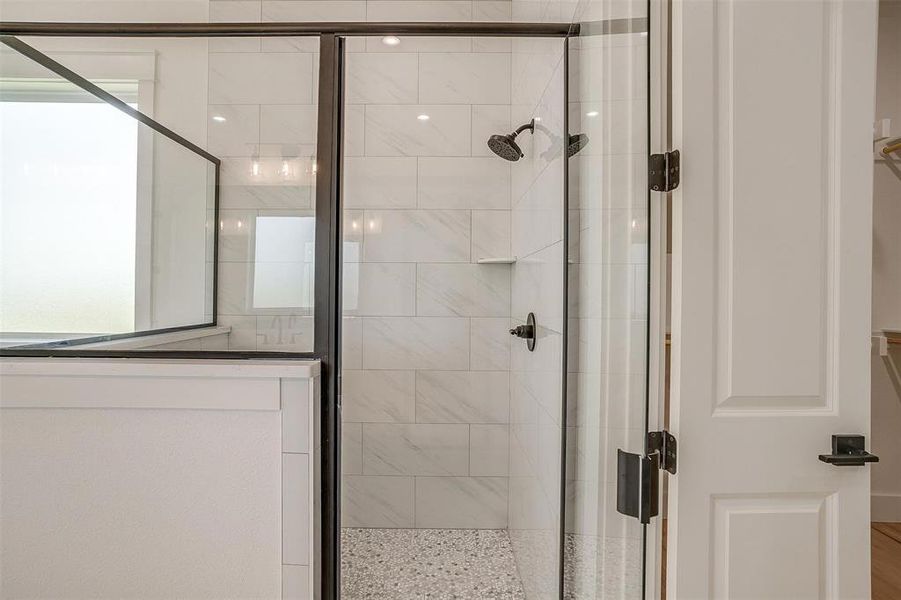Full bath featuring a shower stall