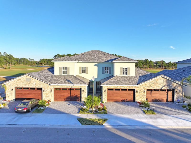 Front exterior of a home in the Isles at Venetian Bay/TH community, located in New Smyrna Beach, FL (Image 4).