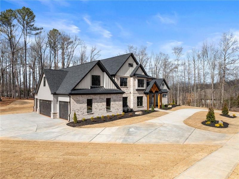 Front exterior of a new home in , Hoschton, GA, highlighting curb appeal (Image 32). Front exterior of a new home in , Hoschton, GA, highlighting curb appeal (Image 32).