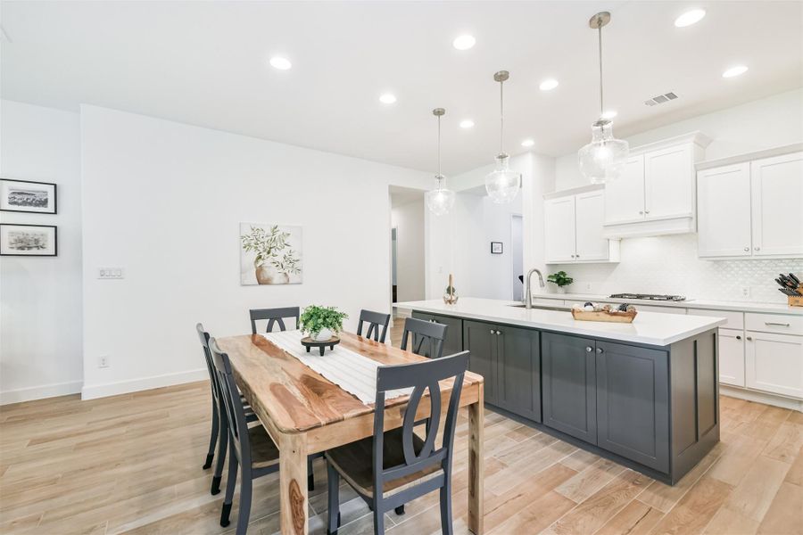 Kitchen island has extra storage space on the dining room side. Kitchen island has extra storage space on the dining room side.