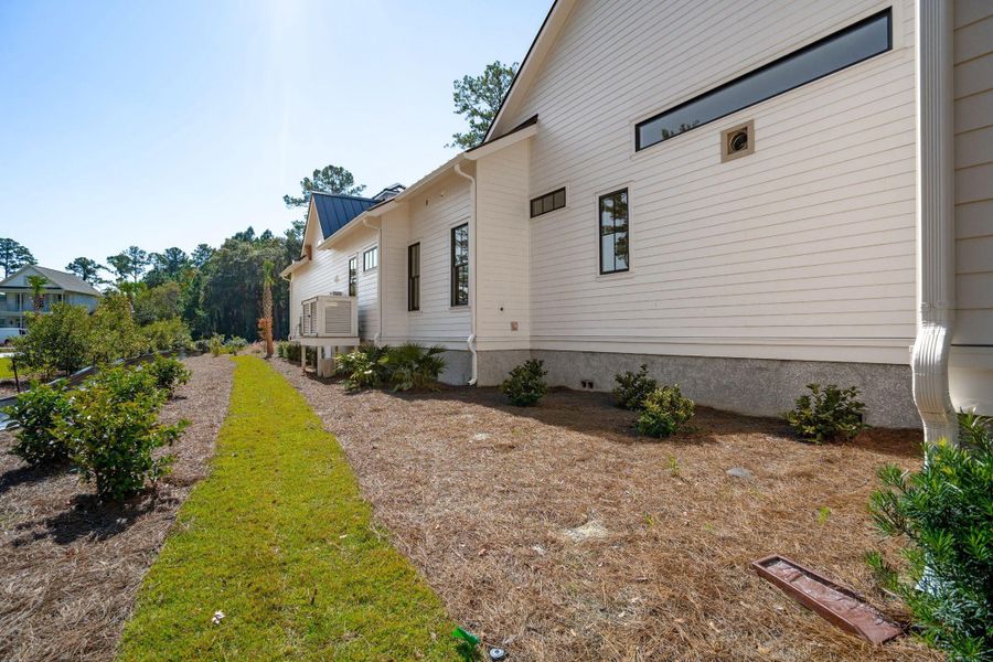 Exterior details and patio area of a home in , Ravenel (Image 36).