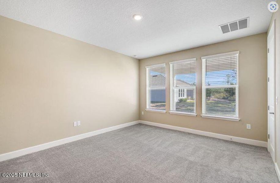 Spacious, unfurnished interior of a new home in Colbert Landings, Palm Coast (Image 11).