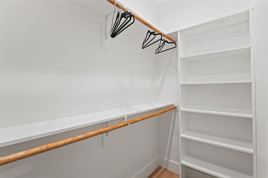 Walk in closet featuring hardwood / wood-style floors