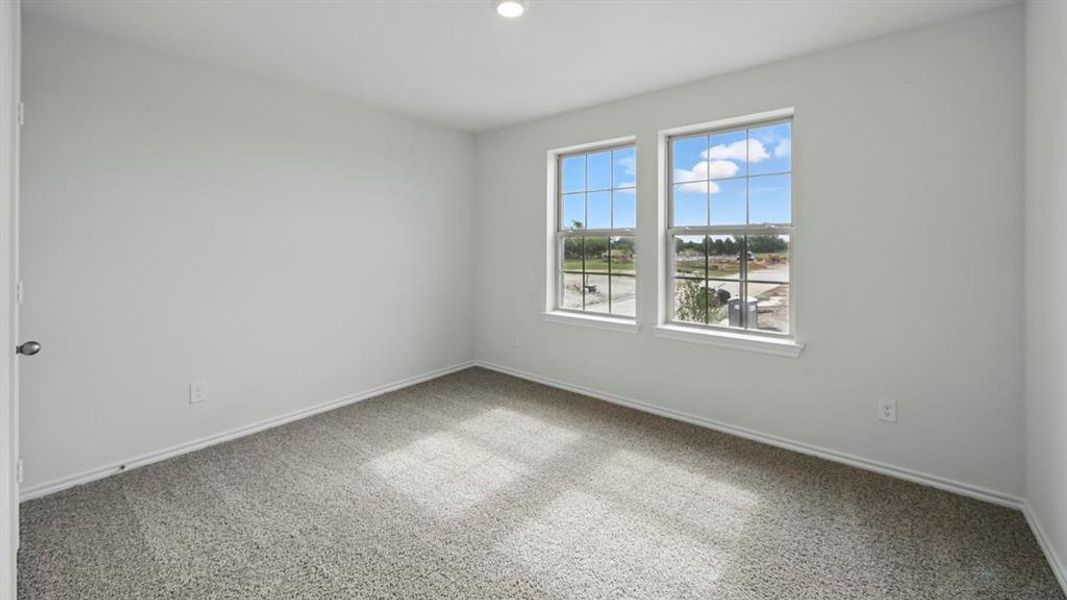 Empty room featuring carpet floors and recessed lighting