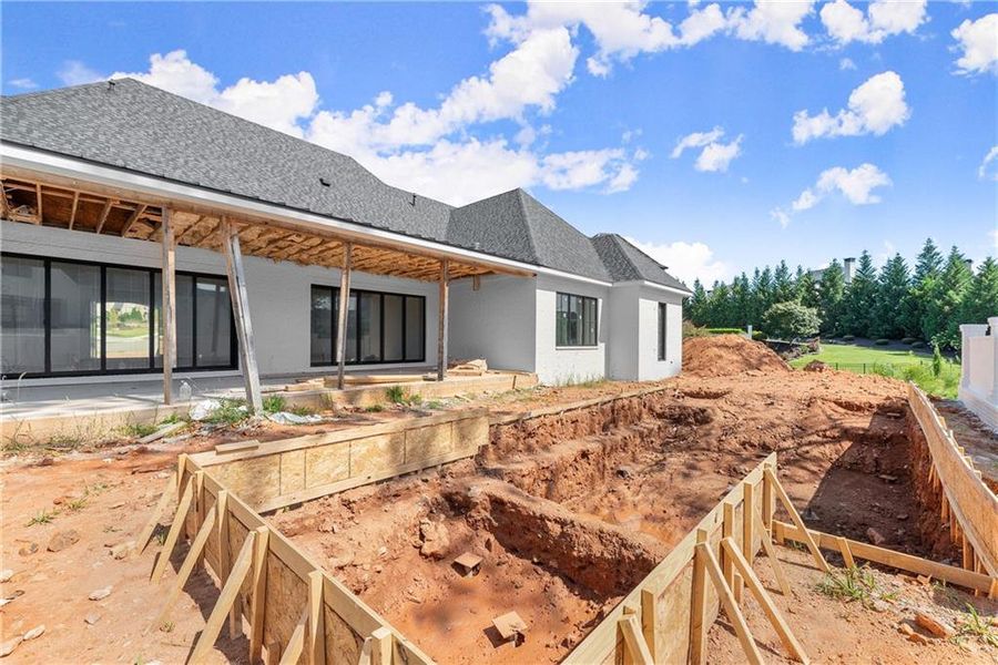 Front exterior of a new home in , Alpharetta, GA, highlighting curb appeal (Image 9).