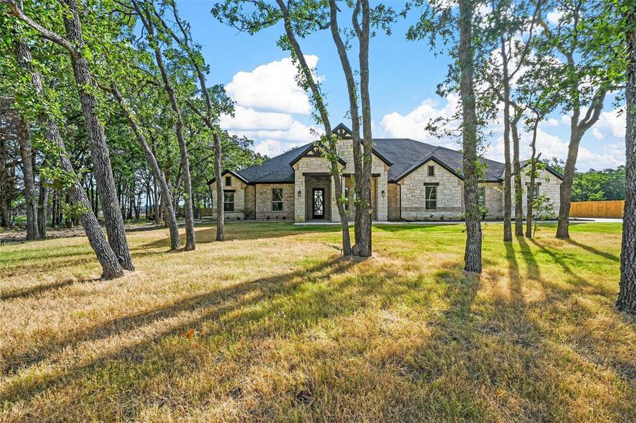 French country style house with a front yard