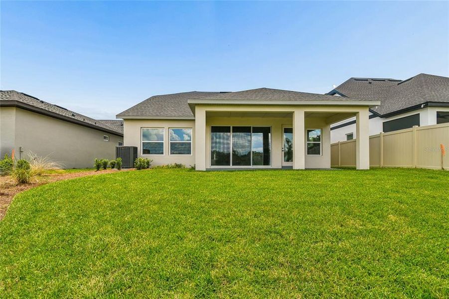 Exterior details and patio area of a home in Oakfield at Mount Dora Village Series, Mount Dora (Image 26).