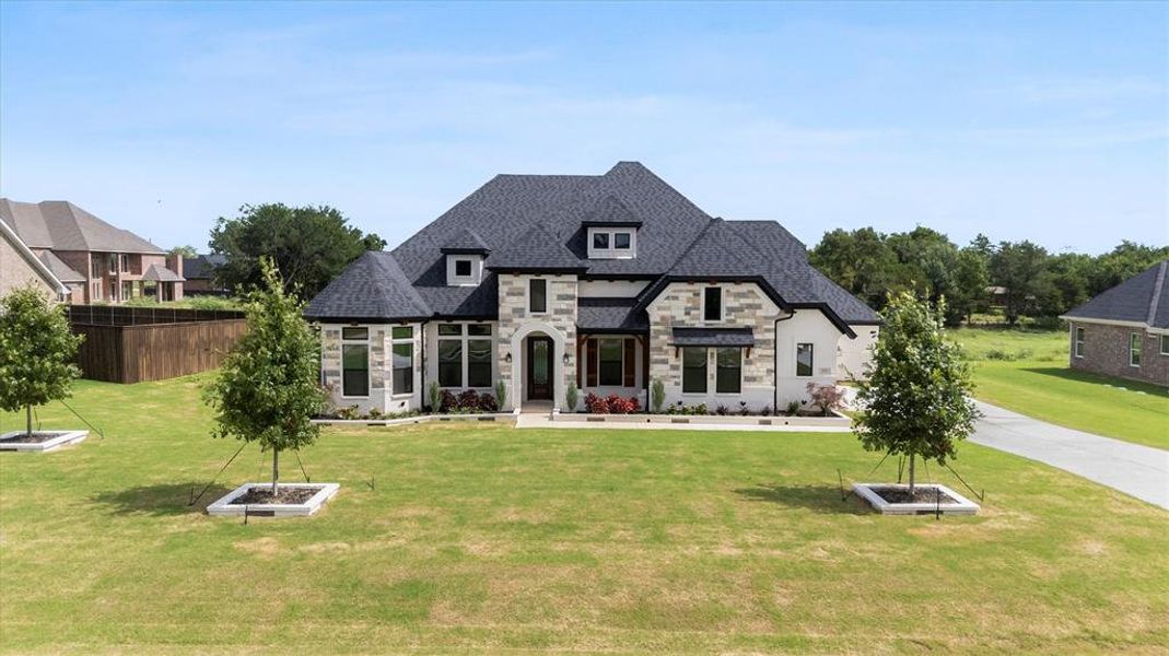 Front exterior of a new home in , Midlothian, TX, highlighting curb appeal (Image 1). Front exterior of a new home in , Midlothian, TX, highlighting curb appeal (Image 1).