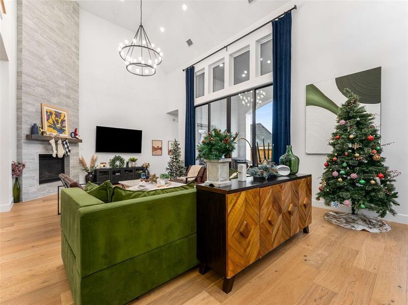 Living room with soaring ceiling and a show stopper fireplace