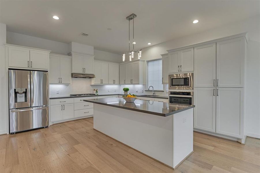 Flow and function make this kitchen well appointed for a chef! Note: the refrigerator stays!