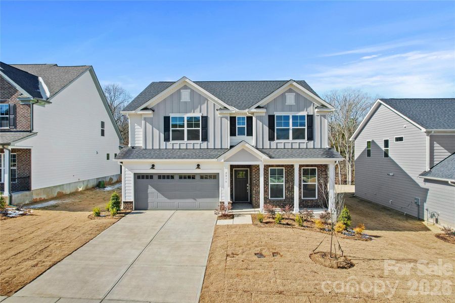 Front exterior of a new home in Forest Creek, Waxhaw, NC, highlighting curb appeal (Image 23).