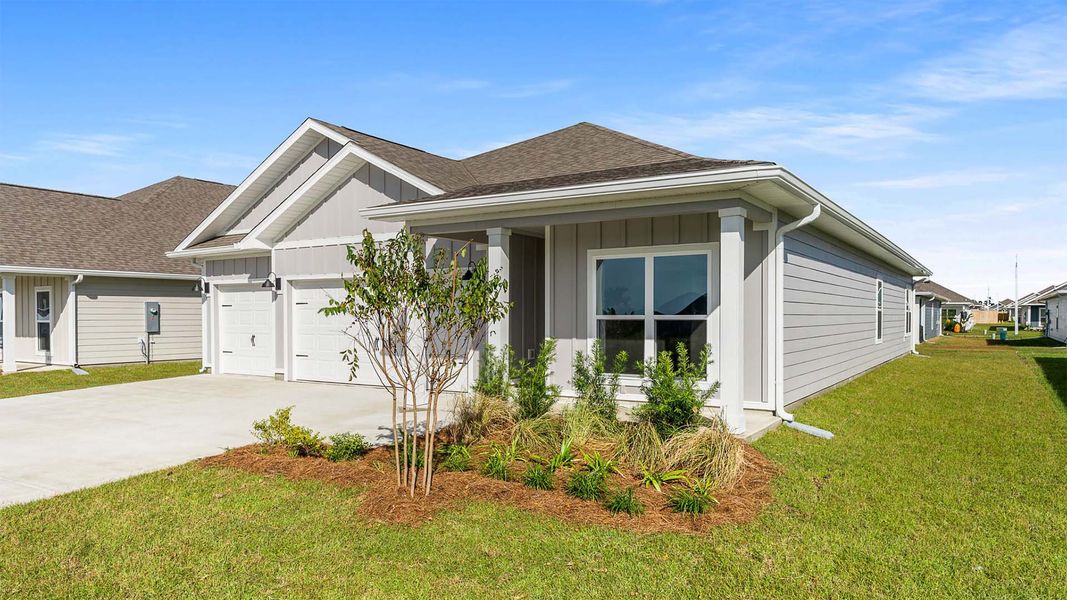 Front exterior of a new home in Titus Park, Panama City, FL, highlighting curb appeal (Image 24).