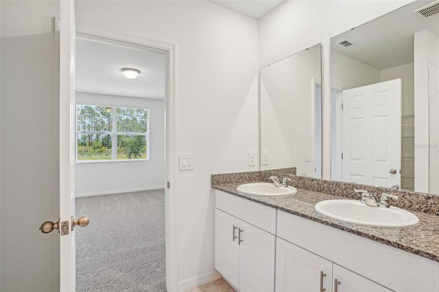 Furnished interior view inside a new home in Lake Deer Estates - Signature Series, Poinciana (Image 9). Furnished interior view inside a new home in Lake Deer Estates - Signature Series, Poinciana (Image 9).