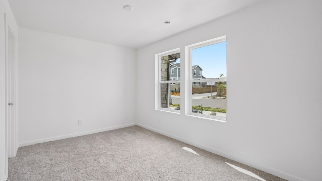 Secondary bedroom with closet, window, and quality finishes. Secondary bedroom with closet, window, and quality finishes.