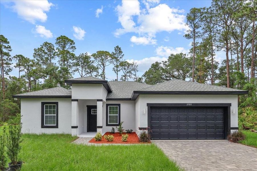 Front exterior of a new home in , Indian Lake Estates, FL, highlighting curb appeal (Image 23). Front exterior of a new home in , Indian Lake Estates, FL, highlighting curb appeal (Image 23).
