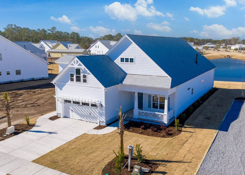 Front exterior of a new home in The Sanctuary at Sunset Beach, Sunset Beach, NC, highlighting curb appeal (Image 21).