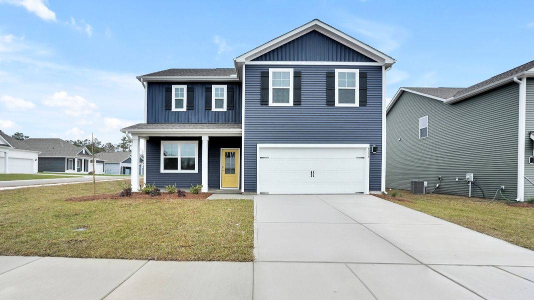 Front exterior of a new home in Bella Point, Bolivia, NC, highlighting curb appeal (Image 1). Front exterior of a new home in Bella Point, Bolivia, NC, highlighting curb appeal (Image 1).