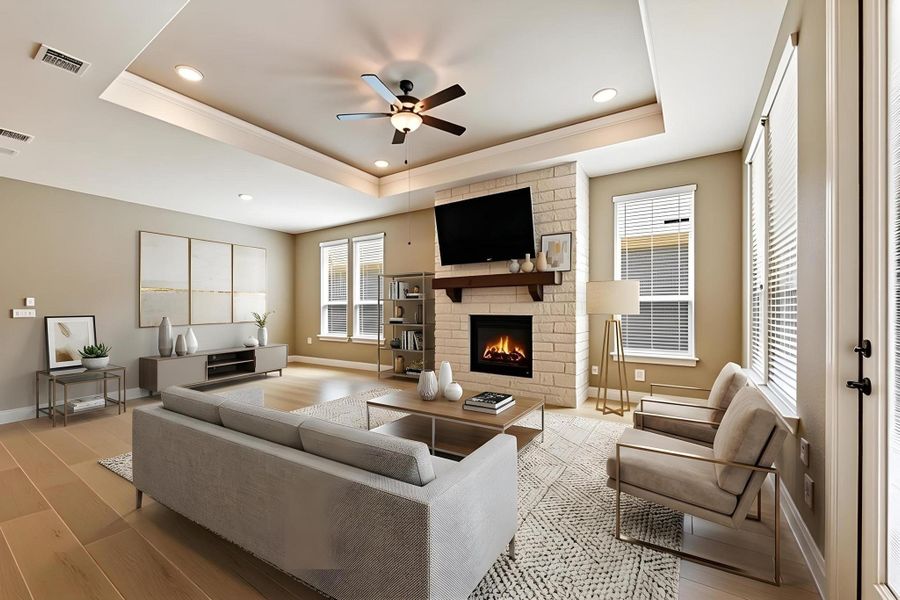 Recessed lighting illuminates this inviting living space, showcasing a cozy fireplace and rich hardwood flooring. Recessed lighting illuminates this inviting living space, showcasing a cozy fireplace and rich hardwood flooring.