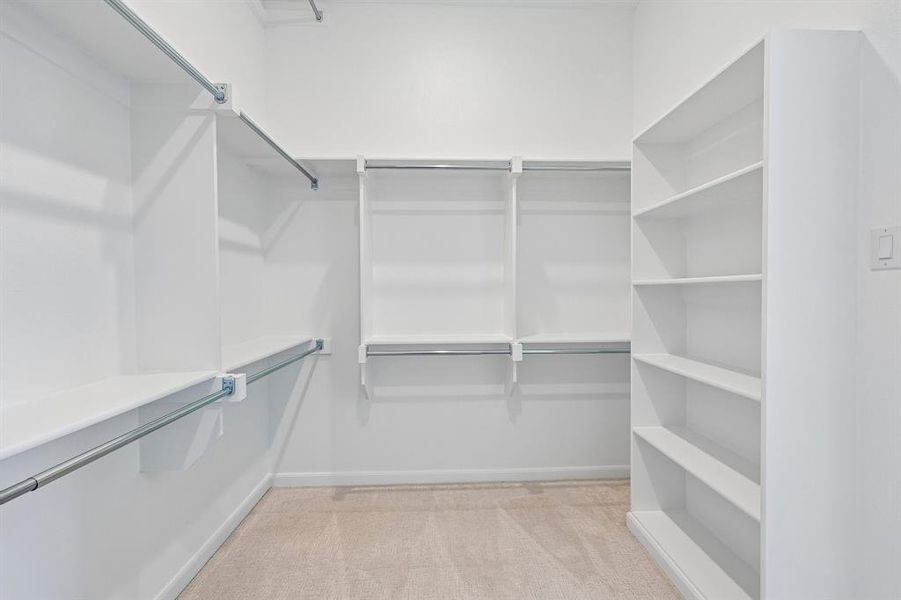 Your dreamy owner's closet features seasonal hanging racks and ample room for two! Your dreamy owner's closet features seasonal hanging racks and ample room for two!
