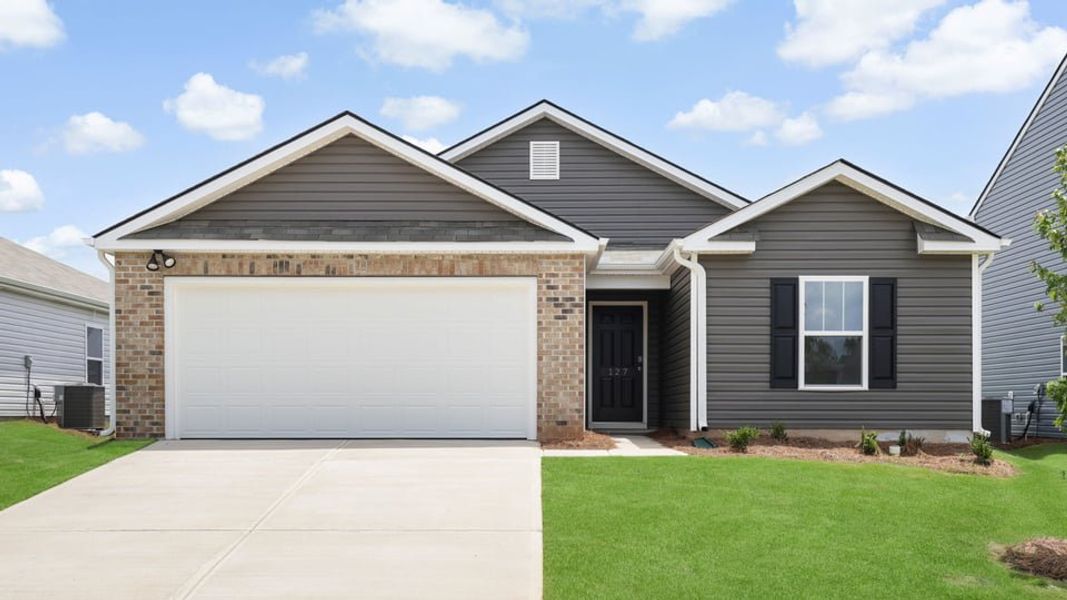 Front exterior of a new home in Treemont Commons, Wellford, SC, highlighting curb appeal (Image 1). Front exterior of a new home in Treemont Commons, Wellford, SC, highlighting curb appeal (Image 1).