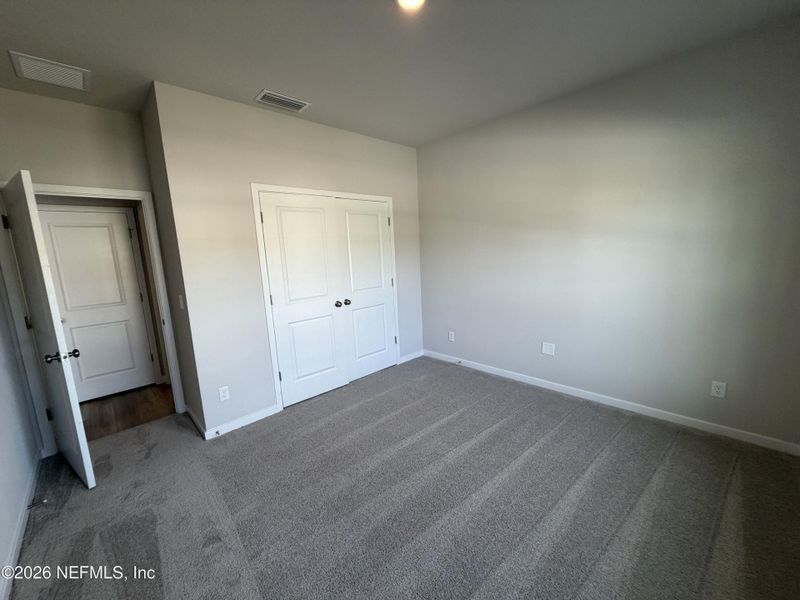 Spacious, unfurnished interior of a new home in The Cypress Series at Reserve East, Flagler Beach (Image 13).