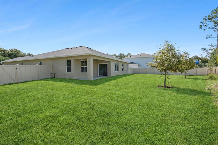 Exterior details and patio area of a home in Fountain View, Ormond Beach (Image 2).