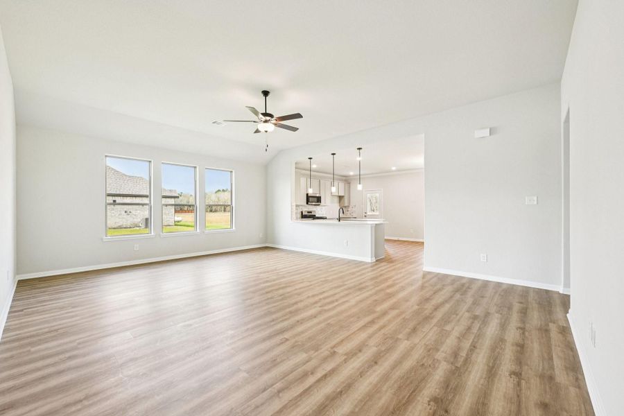 Bright, OPEN-CONCEPT living area with tons of natural light—perfect for entertaining!