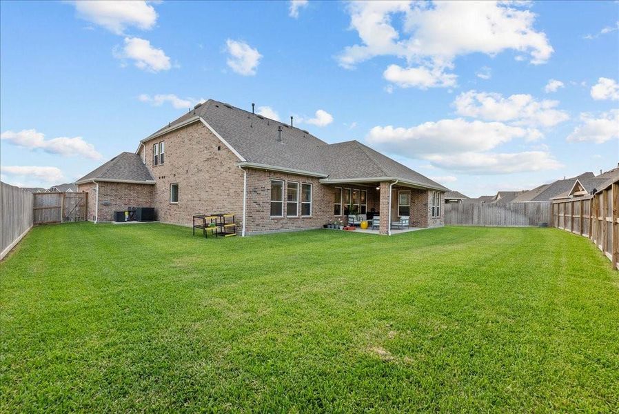 Exterior details and patio area of a home in Westland Ranch - 70' Homesites, League City (Image 4).