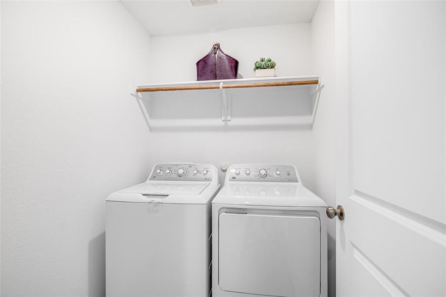 Clothes washing area featuring independent washer and dryer