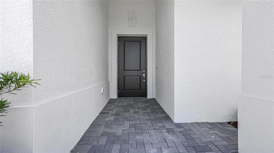 Exterior details and patio area of a home in Woodland Preserve, Parrish (Image 24).
