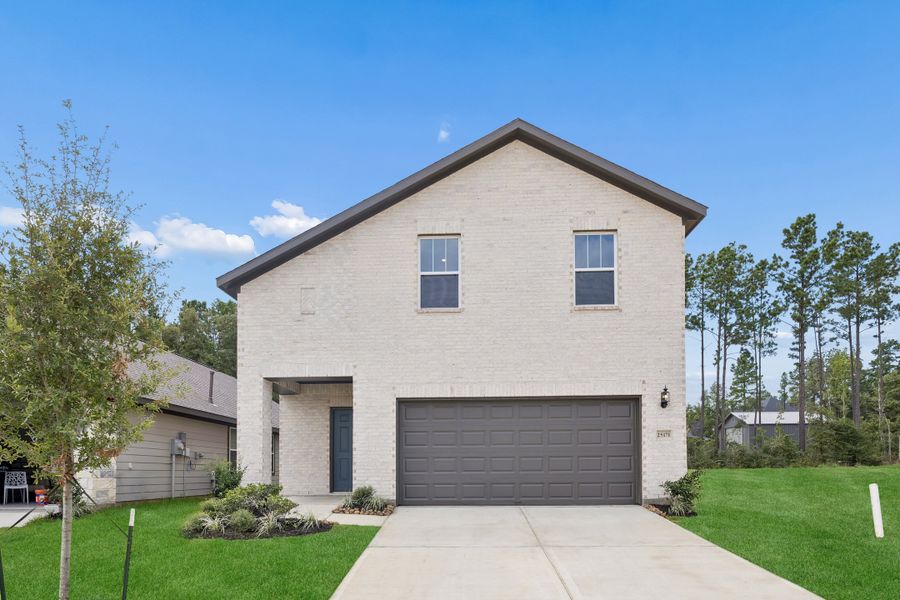Front exterior of a new home in Magnolia Springs, Montgomery, TX, highlighting curb appeal (Image 1). Front exterior of a new home in Magnolia Springs, Montgomery, TX, highlighting curb appeal (Image 1).