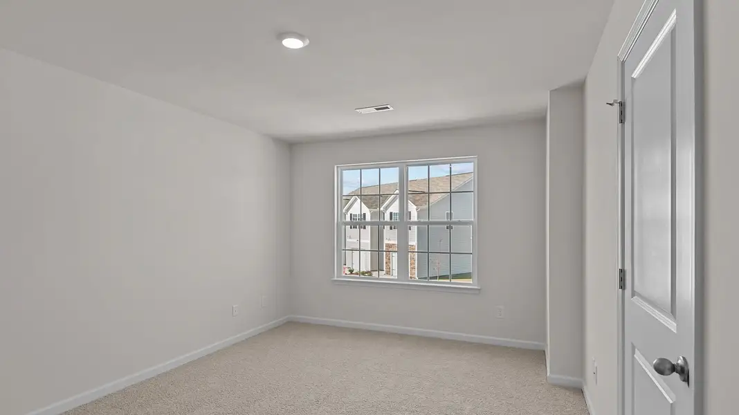Spacious, unfurnished interior of a new home in Edinborough Townes, Gibsonville (Image 10).