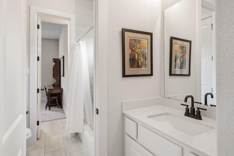 A shared bath sits in between two of the guest bedrooms
