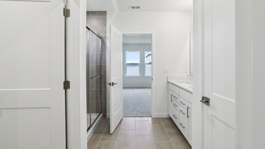Naples First Floor Primary Suite with en suite bath with large walk-in closet at Grasslands West in Lakeland FL