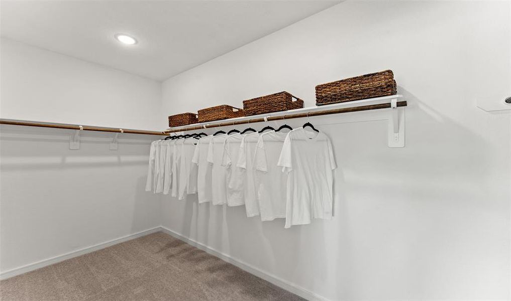 Walk-in closet in primary suite (*Photo not of actual home and used for illustration purposes only.)