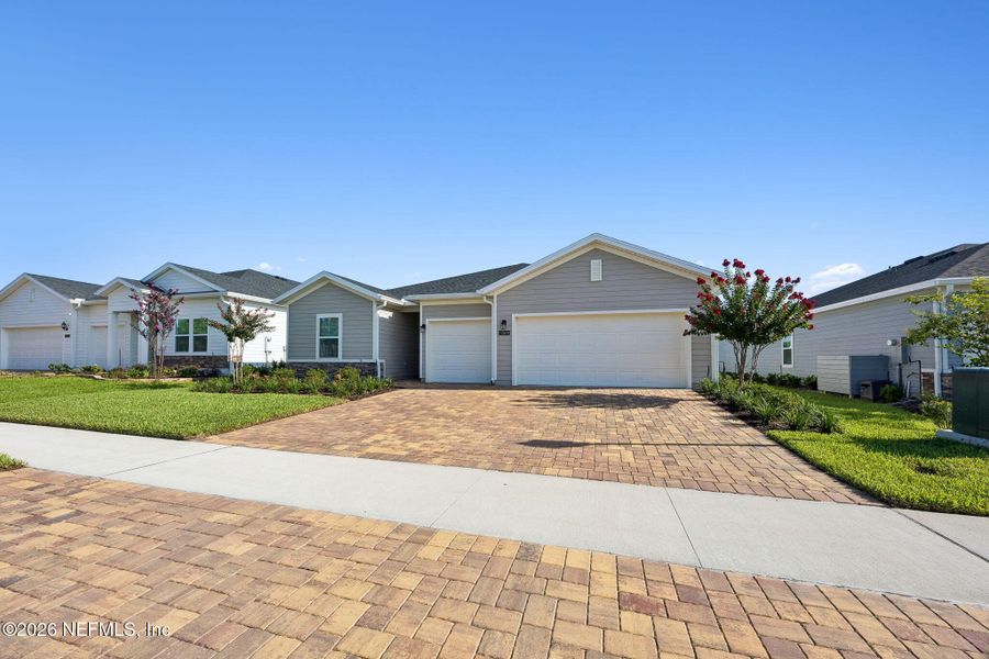 Front exterior of a new home in Edenbrooke at Hyland Trail | 55+, Green Cove Springs, FL, highlighting curb appeal (Image 27). Front exterior of a new home in Edenbrooke at Hyland Trail | 55+, Green Cove Springs, FL, highlighting curb appeal (Image 27).