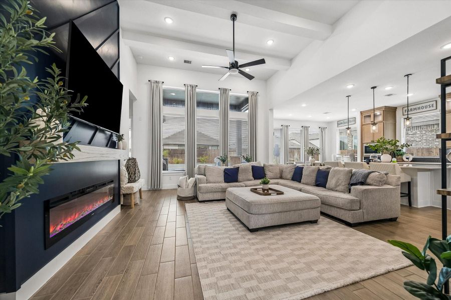 ANOTHER GORGEOUS UPGRADE - THIS ACCENT WALL FLANKS THE FIREPLACE AND MAKES THE SPACE FEEL LIKE A MODEL HOME!