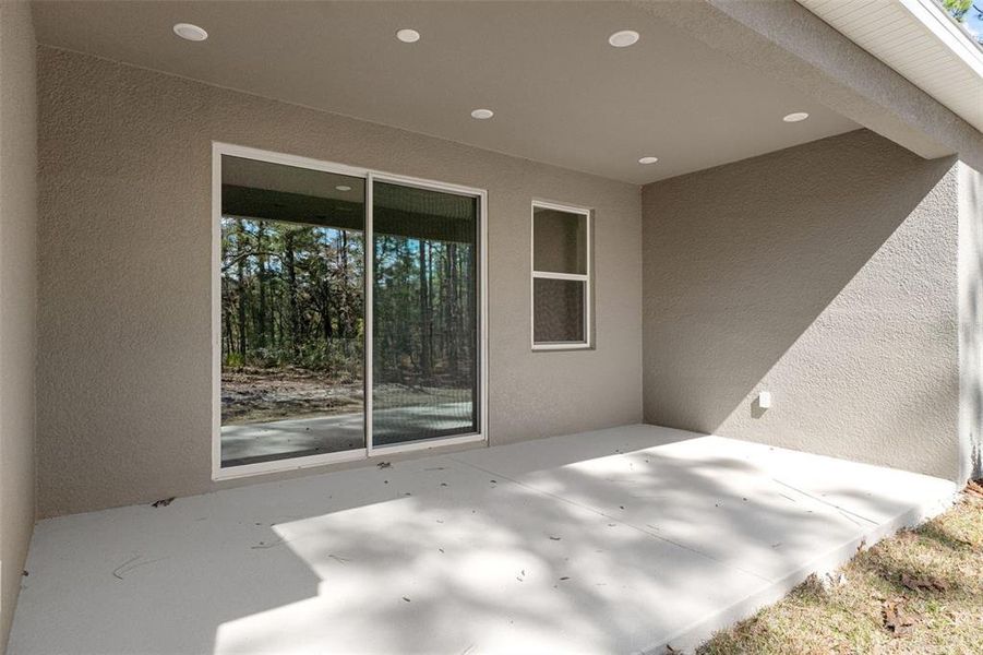 Exterior details and patio area of a home in Pine Ridge Estates, Beverly Hills (Image 25).