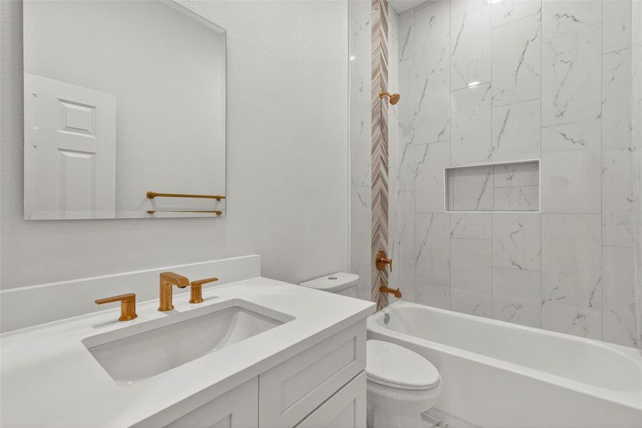 Bathroom featuring vanity and tub / shower combination