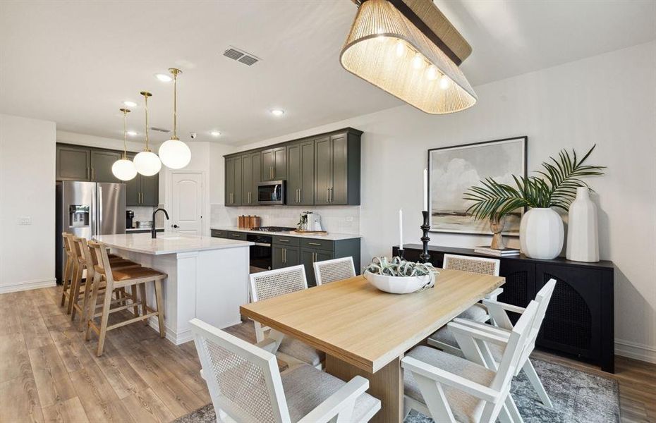 Dining nook off kitchen with large windows