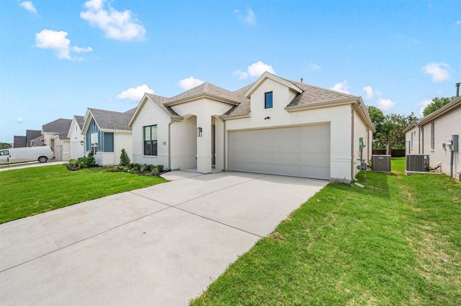 Front exterior of a new home in Parks of Aledo, Aledo, TX, highlighting curb appeal (Image 22). Front exterior of a new home in Parks of Aledo, Aledo, TX, highlighting curb appeal (Image 22).