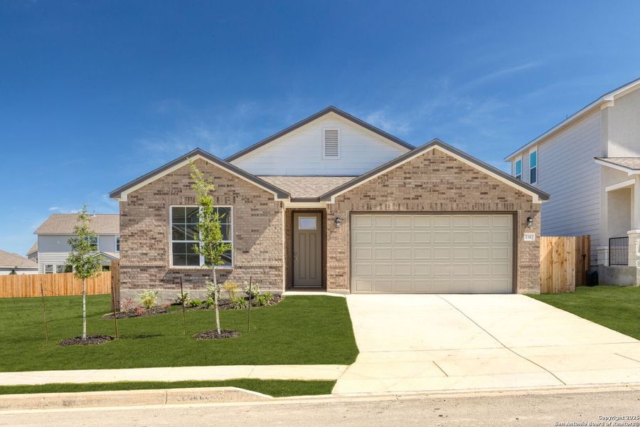 Front exterior of a new home in Skybrooke, Live Oak, TX, highlighting curb appeal (Image 2).