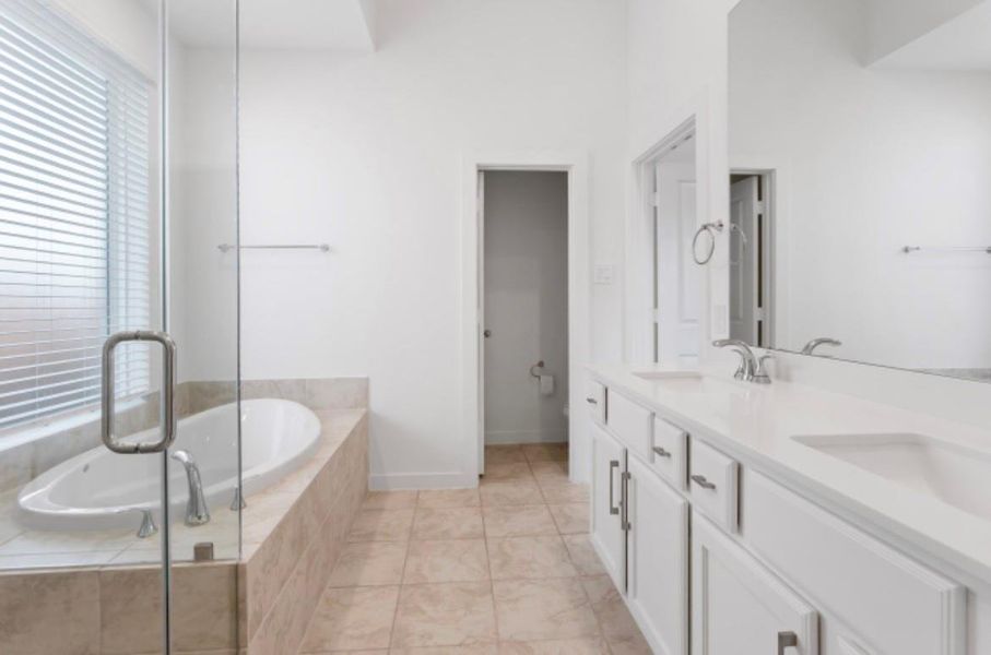 Master bath boasts a dual sink vanity perfect for busy mornings. Master bath boasts a dual sink vanity perfect for busy mornings.