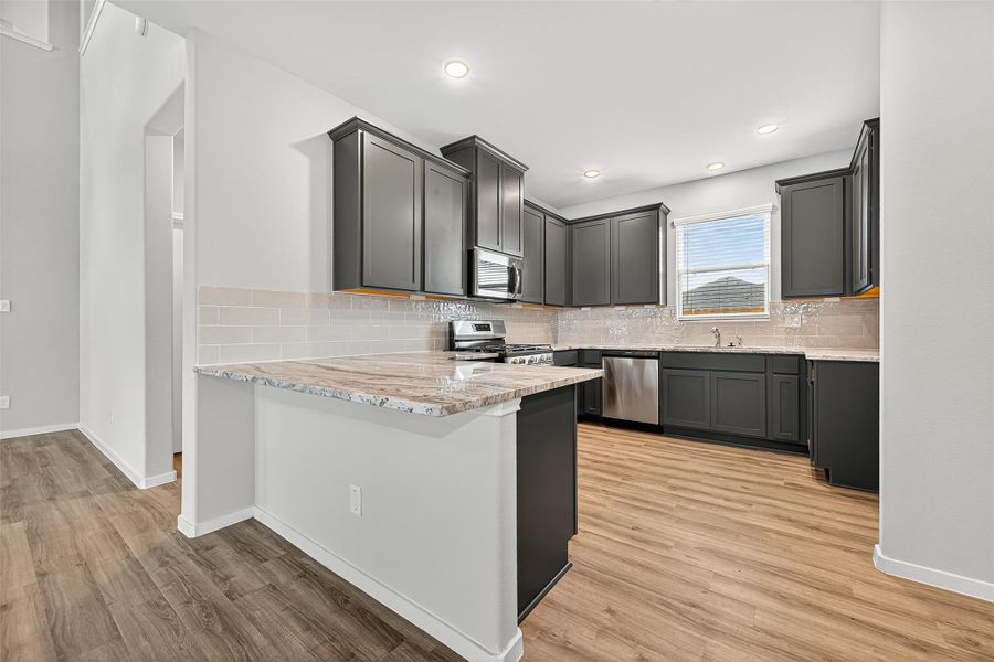 Furnished interior view inside a new home in Sunterra, Katy (Image 12).