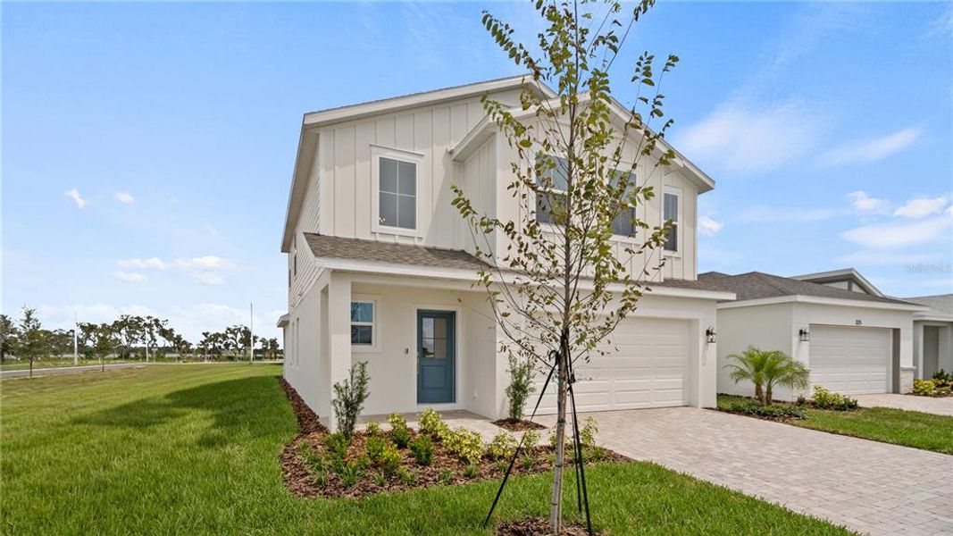 Front exterior of a new home in Willowbrook North, Winter Haven, FL, highlighting curb appeal (Image 22).